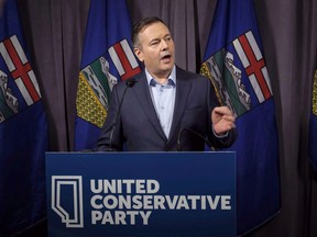Alberta's election commissioner has issued penalties totalling $15,000 surrounding an investigation into the 2017 United Conservative leadership race. Jason Kenney speaks to the media at his first convention as leader of the United Conservative Party in Red Deer, Alta., Sunday, May 6, 2018.
