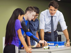 Prime Minister Justin Trudeau visits with students at a high school in Kapuskasing, Ont. on Wednesday, Aug. 29, 2018. Three years after Trudeau promised a national youth policy, the federal government is still trying to determine what it should include.