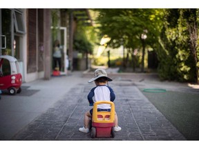 A young boy plays at a daycare in Langley, B.C., on Tuesday May 29, 2018. Daycare fees have dropped - or slowly inched up - in a growing number of Canadian cities that may be early signs of the influence of recently flowing federal child care money, a new survey says.