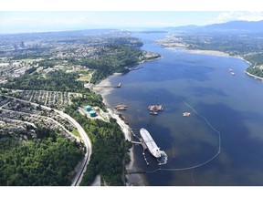 A aerial view of Kinder Morgan's Trans Mountain marine terminal, in Burnaby, B.C., is shown on May 29, 2018. An environmental group that tried to widen the scope of the National Energy Board's reconsideration of the Trans Mountain pipeline expansion says it fully expects the board to endorse the project again in its ruling today."I think the NEB has a long record of siding with industry over communities and other concerns... so we have every expectation that they're going to recommend the project go ahead despite the serious problems with it," said Sven Biggs, climate campaigner for Stand.earth, a Vancouver environmental group formerly called ForestEthics.