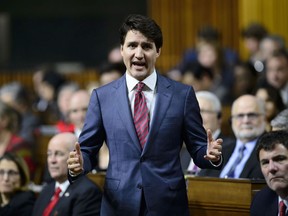 Prime Minister Justin Trudeau stands during question period in the House of Commons in the West Block of Parliament Hill in Ottawa on January 30, 2019. The opposition parties are charging back into the House of Commons today, loaded with questions for Prime Minister Justin Trudeau about what his office did to try to help the embattled Montreal engineering company SNC-Lavalin in its corruption case. Before MPs left for a week in their ridings, Jody Wilson-Raybould was veterans affairs minister and Gerald Butts was Trudeau's principal secretary, his closest adviser. Now they've both quit and it's still not clear what Butts or anyone else in the Prime Minister's Office might have done to push Wilson-Raybould on SNC-Lavalin when she was attorney general and had a say over the charges the company faces.