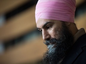 NDP Leader Jagmeet Singh listens while responding to questions after casting his ballot for the federal byelection in Burnaby South, at an advance poll in Burnaby, B.C., on Friday February 15, 2019. Singh is facing calls from within the party for a stronger stance on climate change as he defends his support of the $40-billion LNG Canada project in northern British Columbia.