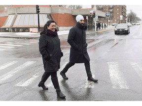 NDP Leader Jagmeet Singh and NDP candidate for the riding of Outremont Julia Sanchez cross a street during a tour of the Montreal borough of Outremont on December 22, 2018. Julia Sanchez, the NDP's candidate in Monday's Outremont byelection, says people in the riding talk to her about climate change, wealth inequality ??? and sometimes what the leader of her party wears on his head. NDP Leader Jagmeet Singh is Sikh and wears a turban, making him conspicuously religious in front of a heavily secular province. His French is also weaker than the two previous party leaders, complicating the job of appealing to Quebec voters.