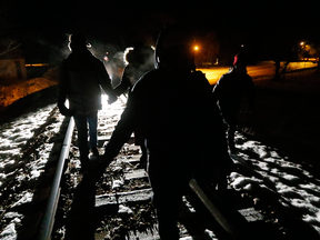 A group of Somalians cross into Canada illegally from the United States by walking down a train track into the town of Emerson, Manitoba, in February 2017.