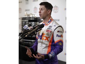 Denny Hamlin answers questions during NASCAR Daytona 500 auto racing media day at Daytona International Speedway, Wednesday, Feb. 13, 2019, in Daytona Beach, Fla.