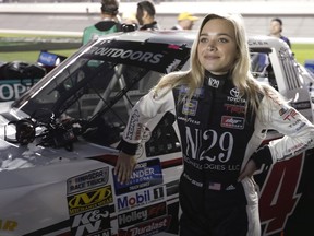 Natalie Decker stands by her truck before the NASCAR Truck Series auto race at Daytona International Speedway, Friday, Feb. 15, 2019, in Daytona Beach, Fla.