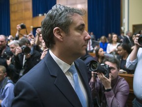 Michael Cohen, President Donald Trump's former lawyer, departs after testifying before the House Oversight and Reform Committee, on Capitol Hill, Wednesday, Feb. 27, 2019, in Washington.