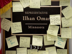 People leave post-it notes of support outside the office of Rep. Ilhan Omar, D-Minn., on Capitol Hill, Monday, Feb. 11, 2019, in Washington. Omar has "unequivocally" apologized for tweets suggesting a powerful pro-Israel interest group paid members of Congress to support Israel. Earlier Monday, House Speaker Nancy Pelosi and other Democrats had rebuked her for the tweets.