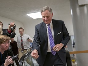 Senate Intelligence Committee Chairman Richard Burr, R-N.C., heads to the Senate as reporters ask about reports that his panel's investigation has found no direct evidence of a conspiracy between President Donald Trump's campaign and Russia, at the Capitol in Washington, Tuesday, Feb. 12, 2019.