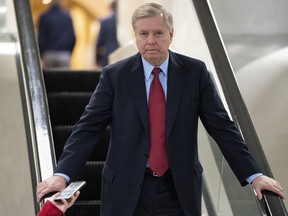 Senate Judiciary Committee Chairman Lindsey Graham, R-S.C., an ally of President Donald Trump, leaves the Senate after voting to confirm William Barr to be attorney general, on Capitol Hill in Washington, Thursday, Feb. 14, 2019.