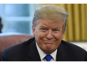 President Donald Trump smiles during his meeting with Chinese Vice Premier Liu He in the Oval Office of the White House in Washington, Friday, Feb. 22, 2019.