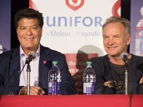 Sting, right, sits alongside Unifor National President Jerry Dias as they speak to the media after Sting and the cast of his musical "The Last Ship" performed in support of General Motors workers in Oshawa, on Thursday, Feb. 14, 2019.