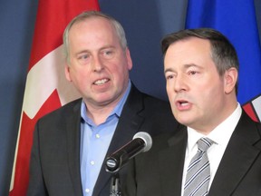 Len Rhodes, left, the former CEO of the Edmonton Eskimos football team, stands with United Conservative Leader Jason Kenney Thursday to announce Rhodes will run as a UCP candidate in Alberta's upcoming election at a press conference in Edmonton on Thursday, Feb. 21, 2019.