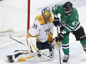 Nashville Predators goaltender Pekka Rinne (35) defends the goal against Dallas Stars right wing Alexander Radulov (47) during the first period of an NHL hockey game in Dallas, Tuesday, Feb. 19, 2019.