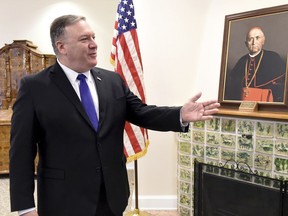 US Secretary of State, Mike Pompeo, gestures in the memorial room of late Hungarian Cardinal Jozsef Mindszenthy  at the US embassy in Budapest, Hungary, Feb. 11, 2019. Mindszenthy lived in this room at the US embassy building after the 1956 Hungarian uprising, between November 4, 1956 and September 28, 1971.