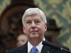 In this Jan. 23, 2018, former Michigan Gov. Rick Snyder delivers his State of the State address at the state Capitol in Lansing, Mich. In his final days in office, Snyder erased the felony drunken-driving conviction of Jim Jagger who pleaded for a pardon so he could seek a lucrative promotion as the next president of the Michigan Association of Certified Public Accountants.