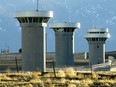 In this Feb. 21, 2007, file photo, guard towers loom over the administrative maximum security federal prison called Supermax near Florence, Colo.