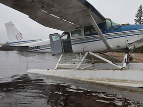A float plane which crashed in the Northwest Territories is shown in a Transportation Safety Board handout photo.The TSB is issuing a warning over the doors on a small floatplane after three passengers drowned on a sightseeing flight in the Northwest Territories last August.The passengers died in August after the Cessna crashed during an attempted landing on a remote lake. THE CANADIAN PRESS/HO-Transportation Safety Board MANDATORY CREDIT