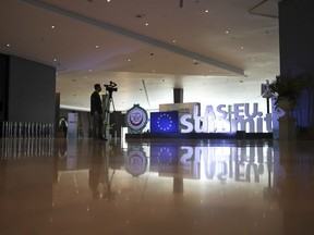 A television cameraman works at the entrance hall of the Sharm El Sheikh convention centre in Sharm El Sheikh, Egypt, Saturday, Feb. 23, 2019.