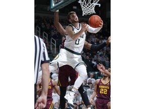 Michigan State's Kyle Ahrens (0) goes to the basket against Minnesota during the first half of an NCAA college basketball game, Saturday, Feb. 9, 2019, in East Lansing, Mich.