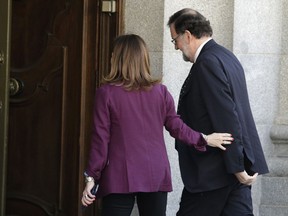 Former Spanish Prime Minister Mariano Rajoy arrives at the court to the testify in the ongoing trial of Catalan separatists in Madrid, Spain, Wednesday, Feb. 27, 2019.