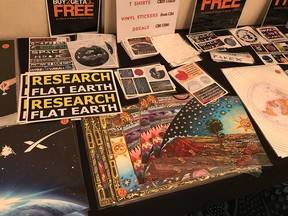 Merchandise is displayed at a "flat-Earth" conference in Edmonton on Aug. 10, 2018.