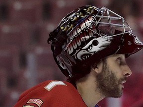 Florida Panthers goaltender Roberto Luongo wears a Marjory Stoneman Douglas High School logo on his helmet during practice before an NHL hockey game Thursday, Feb. 14, 2019, in Sunrise, Fla. Seventeen people were slain during a school shooting on Feb. 14, 2018, in Parkland, Fla.