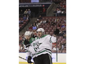 Dallas Stars right wing Alexander Radulov, right, and left wing Roope Hintz celebrate a goal by Dallas Stars center Tyler Seguin during the first period of an NHL hockey game against the Florida Panthers, Tuesday, Feb. 12, 2019, in Sunrise, Fla.