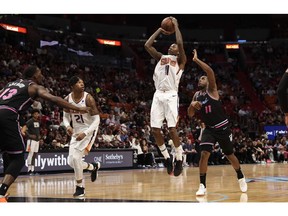 Phoenix Suns guard Jamal Crawford (11) shoots against Miami Heat guard Dion Waiters (11) during the first half of an NBA basketball game Monday, Feb. 25, 2019, in Miami.