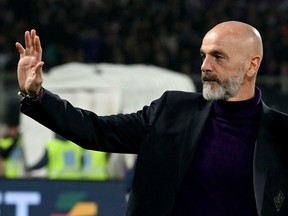 Fiorentina coach Stefano Pioli salutes prior to the Italian Serie A soccer match between Fiorentina and Napoli at the Artemio Franchi stadium in Florence, Italy, Saturday, Feb. 9, 2019.