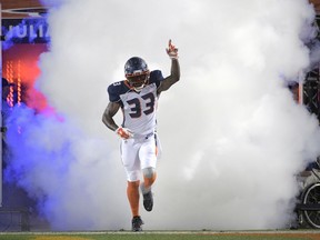 Orlando Apollos safety Will Hill III runs onto the field during player introductions for the team's Alliance of American Football game against the Atlanta Legends on Saturday, Feb. 9, 2019, in Orlando, Fla.