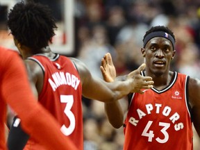 Toronto Raptors forward Pascal Siakam (43) celebrates a basket with forward OG Anunoby (3) during second half NBA basketball action against the Washington Wizards in Toronto on Wednesday, February 13, 2019.