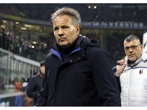 Bologna coach Sinisa Mihajlovic enters the pitch prior to the Serie A soccer match between Inter Milan and Bologna, at the San Siro stadium in Milan, Italy, Sunday, Feb. 3, 2019.
