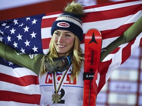 United States' Mikaela Shiffrin celebrates after winning g the bronze medal in the women's giant slalom, at the alpine ski World Championships in Are, Sweden, Thursday, Feb. 14, 2019.