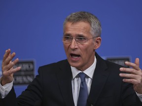 NATO's Secretary General Jens Stoltenberg gestures during a news conference at NATO headquarters in Brussels, Tuesday, Feb. 12, 2019.