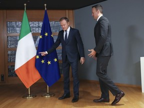 Irish Prime Minister Leo Varadkar, right, is welcomed by European Council President Donald Tusk before their talks at the Europa building in Brussels, Wednesday, Feb. 6, 2019.