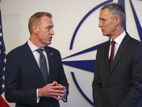 Acting US Defence Secretary Patrick Shanahan, left, talks to NATO's Secretary General Jens Stoltenberg for the media during a meeting of NATO defence ministers at NATO headquarters in Brussels, Wednesday, Feb. 13, 2019.