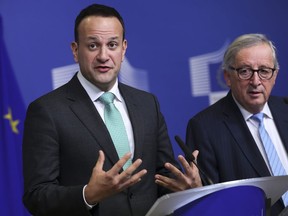 Irish Prime Minister Leo Varadkar, left, answers a question during a joint news conference with European Commission President Jean-Claude Juncker following their meeting at the European Commission headquarters in Brussels, Wednesday, Feb. 6, 2019.
