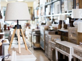 A lamp is on display at a used furniture shop. Ikea has launched a program which allows customers to sell back their used Ikea furniture to the store and receive store credit in return.