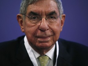 FILE - In this Nov. 13, 2015 file photo, Nobel Peace Prize laureate and two-time Costa Rican President Oscar Arias looks at the media during the opening ceremony of the XV World Summit of Nobel Peace Laureates at the University in Barcelona, Spain. The director of an international center at the University of Nevada in Reno is the latest woman to accuse Arias of sexual misconduct. Carina Black said in an interview that Arias boxed her against a wall inside an elevator in 1998 and then tried to kiss her. She said it happened after she spent a day escorting Arias to meetings and an evening speaking engagement at the university.