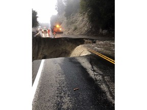 This photo released by Caltrans District 8 shows damage to Highway 243 near Lake Fulmor, Calif., Thursday, Feb. 14, 2019. Waves of heavy rain pounded California on Thursday, flooding streets, triggering a mudslide that destroyed homes and forcing residents to flee communities scorched by wildfires last year. (Caltrans District 8 via AP)