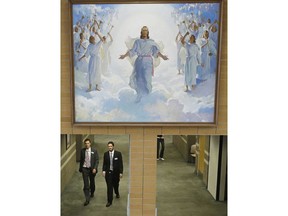 FILE - In this Jan. 8, 2013, file photo, people walk through the halls at the Missionary Training Center in Provo, Utah. Parents of Mormon missionaries will be able to hear their children's voices a lot more often under new rules announced Friday, Feb. 15, 2019, that allow the proselytizing youngsters to call home every week instead of only twice a year.