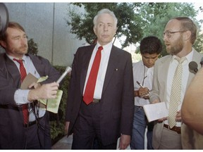 FILE - In this 1990 file photo, former Associated Press Reporter Steve Lawrence, right, questions former State Sen. Paul Carpenter, center, as he leaves the federal courthouse in Sacramento, Calif. Lawrence, a California government reporter who covered a major capital corruption scandal and governors ranging from Ronald Reagan to Arnold Schwarzenegger during a nearly four-decade career with The Associated Press, died Friday, Feb. 22, 2019. His wife, Jane, said he had been battling cancer and had been in the intensive care unit at Sutter Medical Center in Sacramento for about three weeks. He was 71.