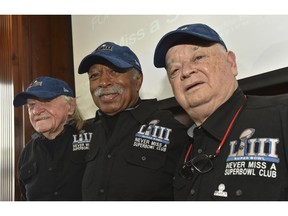 Members of the Never Miss a Super Bowl Club, from left, Tom Henschel, Gregory Eaton and Don Crisman pose for a group photograph during a welcome luncheon in Atlanta on Friday, Feb. 1, 2019.