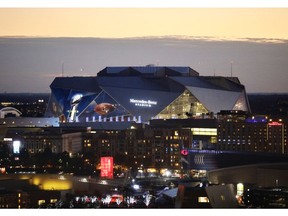 The sun sets behind Mercedes-Benz Stadium ahead of Sunday's NFL Super Bowl 53 football game between the Los Angeles Rams and New England Patriots in Atlanta, Friday, Feb. 1, 2019.