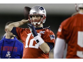 New England Patriots quarterback Tom Brady throws a pass during NFL football practice, Friday, Feb. 1, 2019, in Atlanta, as the team prepares for Super Bowl 53 against the Los Angeles Rams.