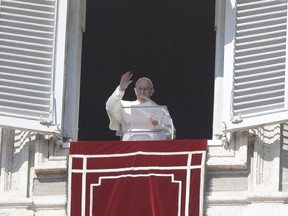 Pope Francis delivers his blessing during the Angelus noon prayer In St. Peter's Square at the Vatican, Sunday, Feb. 17, 2019.