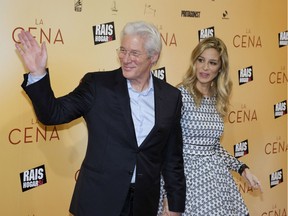 U.S. actor Richard Gere and his partner Alejandra Silva pose on the red carpet as he arrives for the premiere of the film 'The Dinner' in Madrid. Gere and his wife are now parents to a baby boy, Gere's second child.