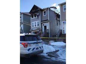 The aftermath of a house fire is seen in the Spryfield community in Halifax on Tuesday, February 19, 2019. Halifax police say they have responded to a fatal fire in the city, although there are no details on how many people are victims. Police say firefighters were called to a home on Quartz Drive in Spryfield around 1 a.m. today.