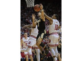 Purdue guard Carsen Edwards (3) tries to shoot as Indiana guard Devonte Green (11) defends during the first half of an NCAA college basketball game in Bloomington, Ind., Tuesday, Feb. 19, 2019.